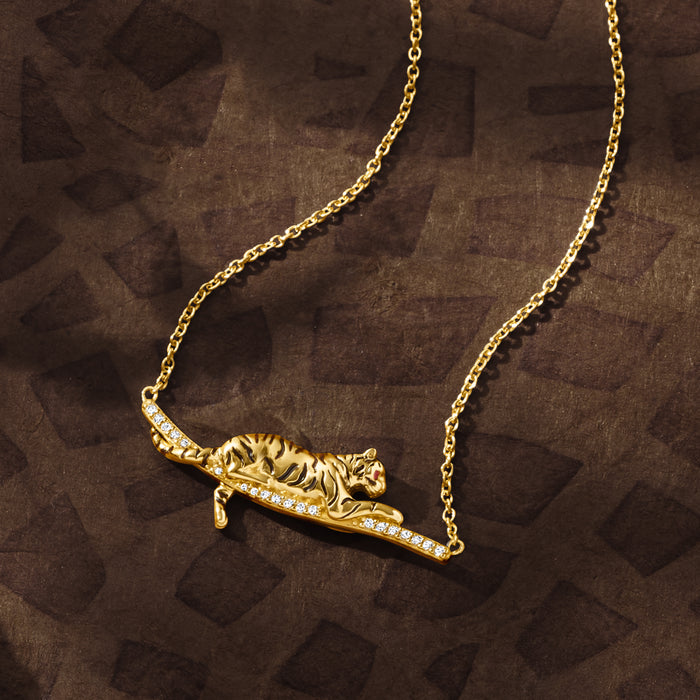Tiger bar necklace with white topaz, black enamel, and ruby accents in gold over sterling