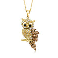 Gold owl pendant necklace with white stone details, dark eye accents, and chain