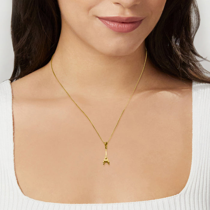 10kt yellow gold Eiffel Tower pendant worn on a thin chain