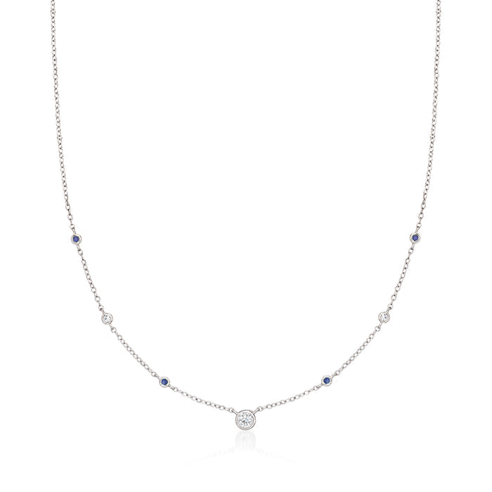 Sterling silver station necklace with round diamonds and blue sapphire accents