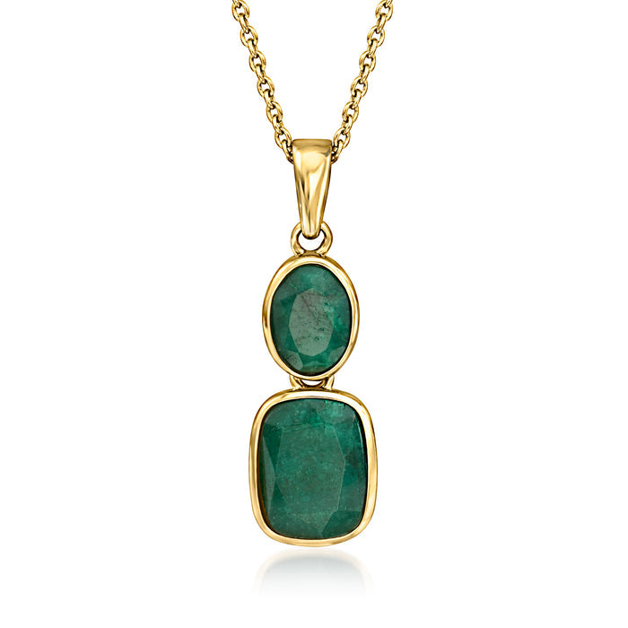 Gold pendant necklace with two green oval gemstones in oval settings
