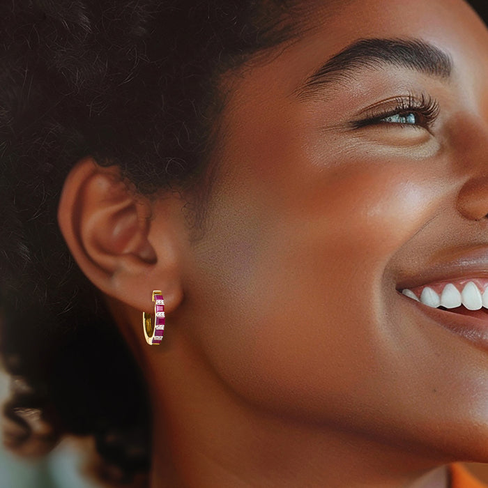 Ruby and diamond hoop earrings in gold, worn on ear with small circular profile