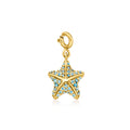 Starfish charm with Swiss and London blue topaz in 18kt gold over sterling