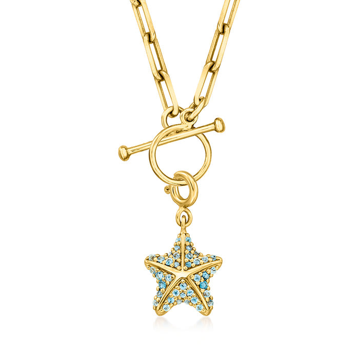 Starfish charm with blue topaz in gold over sterling