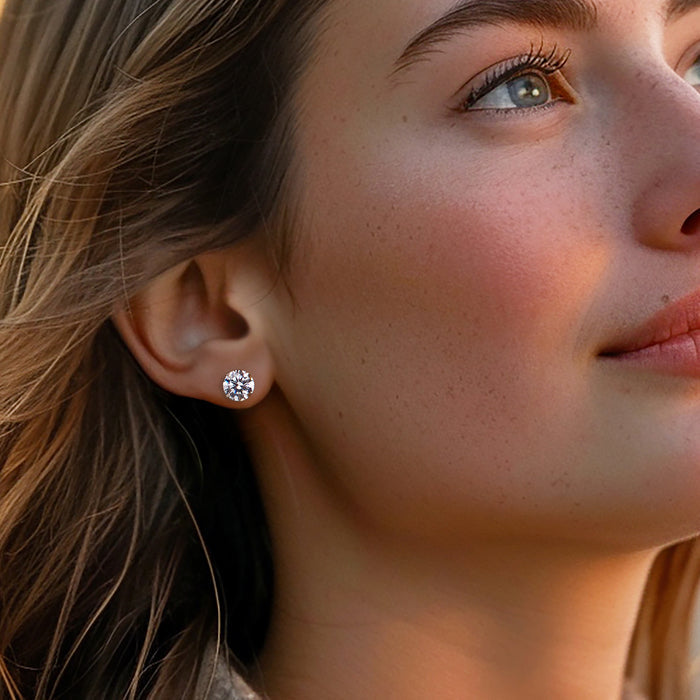 Round CZ stud earrings on model, 14kt white gold, small prong-set stones