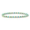Turquoise bead stretch bracelet with yellow gold spacer beads