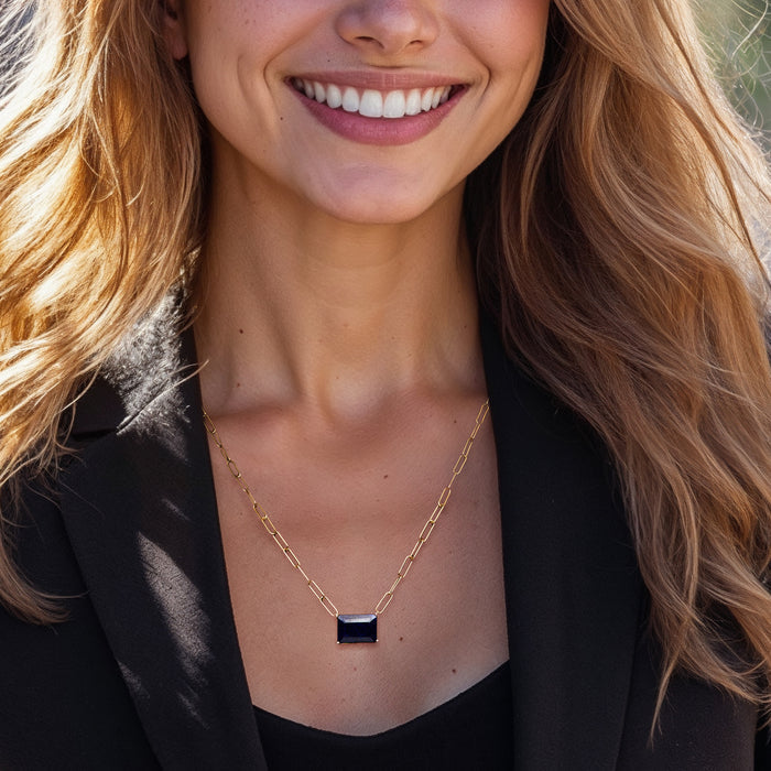 Gold link necklace with rectangular square blue sapphire pendant on neckline