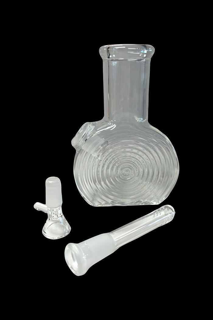 Clear glass bubbler water pipe with separate bowl and downstem pieces, isolated on a black background.
