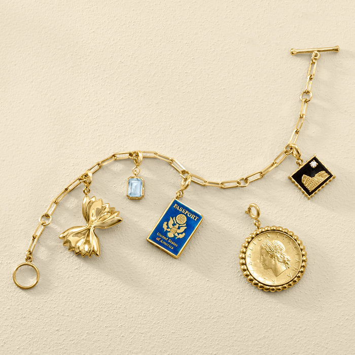 Gold charm bracelet with blue enamel passport charm pendant