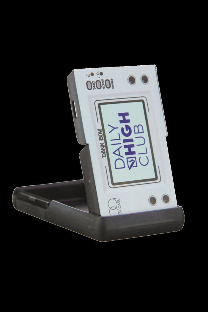 A retro-style, portable cannabis grinder with “Daily High Club” branding.