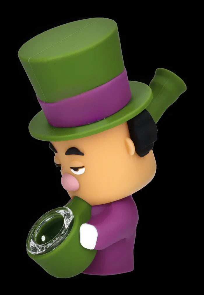 Three-quarter view of the Daily High Club Mad Hatter Silipipe character pipe in green and purple against a black background.