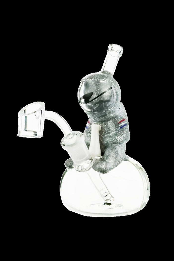 Glass dab rig shaped like an astronaut with quartz banger.