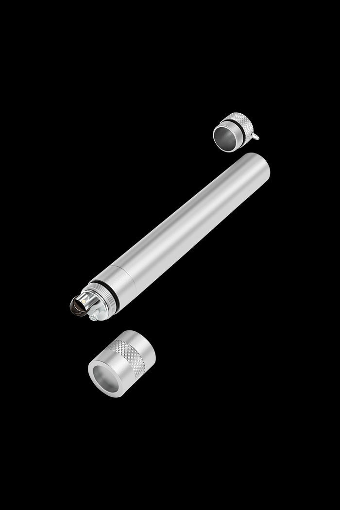 Silver cannabis oil vape pen components disassembled, including cartridge and mouthpiece.