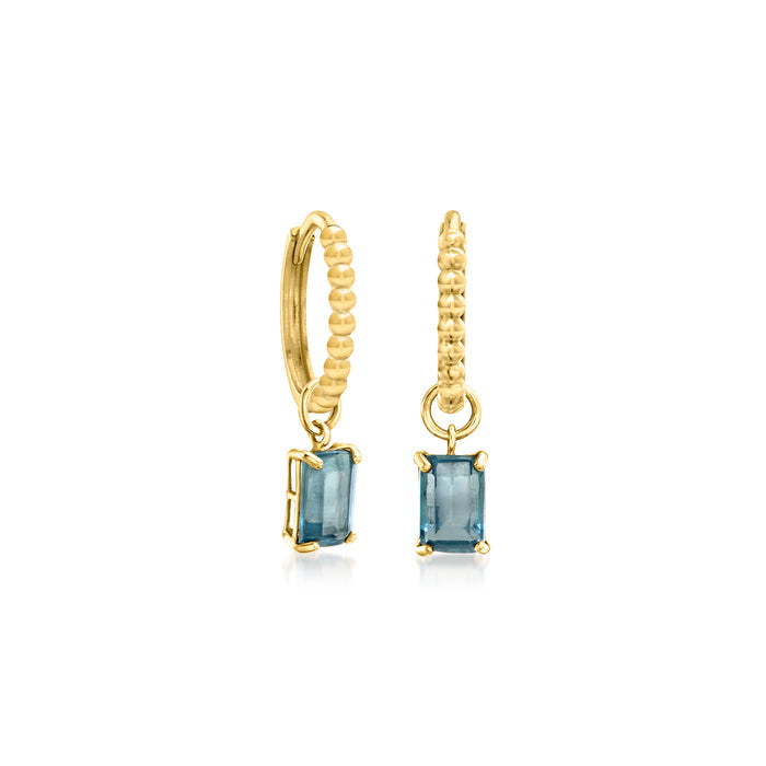 Yellow gold huggie hoops with textured bead ring and blue gemstone-like charms
