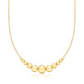 Gold-tone beaded cable-chain necklace with graduated round beads