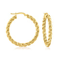 Twisted gold hoop earrings with twisted rope texture and hinged clasp