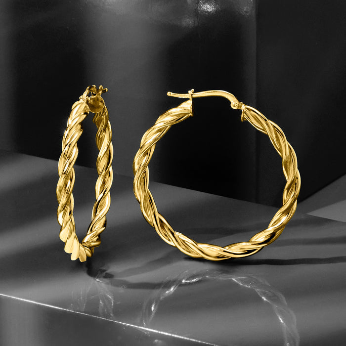 Twisted rope gold hoop earrings, rounded profile with hinged closure