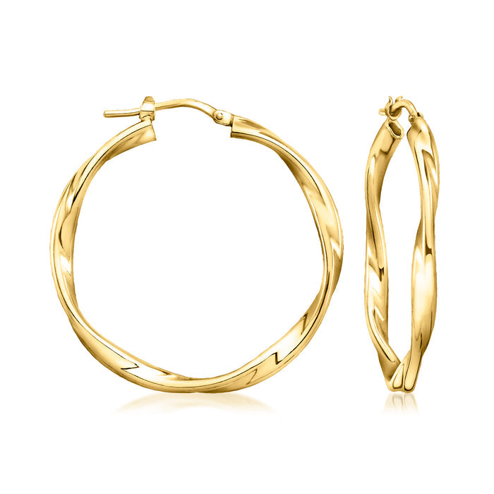Twisted gold-tone hoop earrings with hinged clasp, round profile