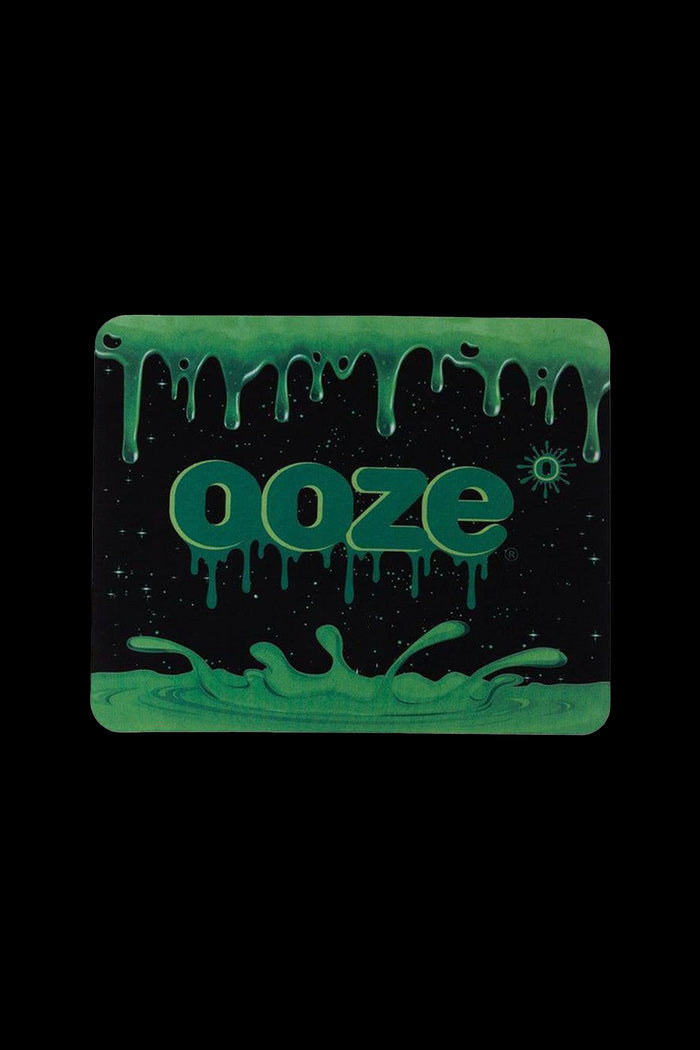 A glowing green square with the brand name “ooze” dripping with viscous liquid, set against a black background.