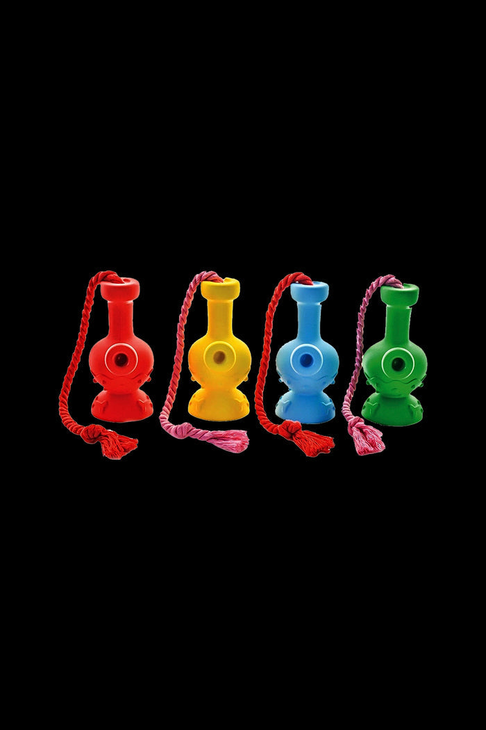 Four colorful glass bubblers with red cords hang in a row against a black background.