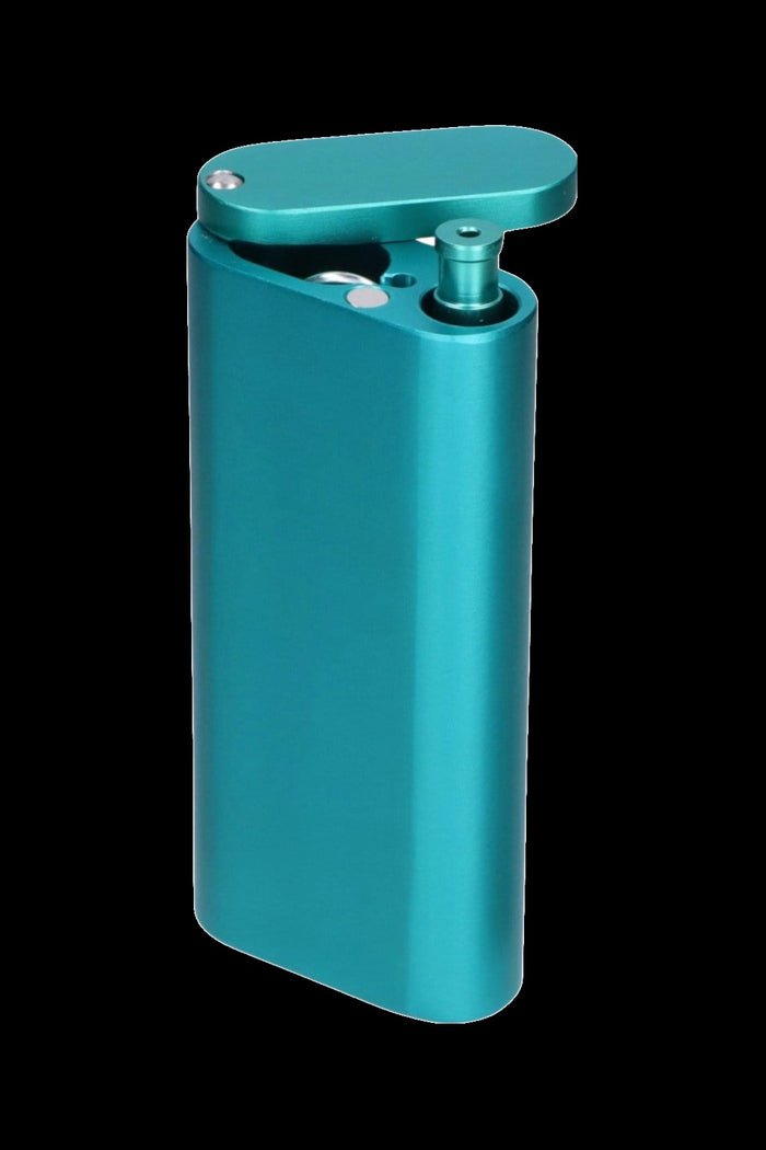 Angled close-up of a metallic turquoise Smoke Cartel Aluminum Dugout And Chillum with its hinged lid open against a black background