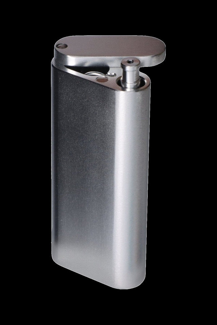 Close-up three-quarter view of a teal Smoke Cartel Aluminum Dugout And Chillum with its hinged lid open against a black background.