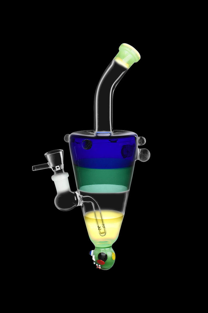 A colorful glass water pipe (rig) with a swirling, layered design in shades of blue, green, and yellow, isolated on a black background.