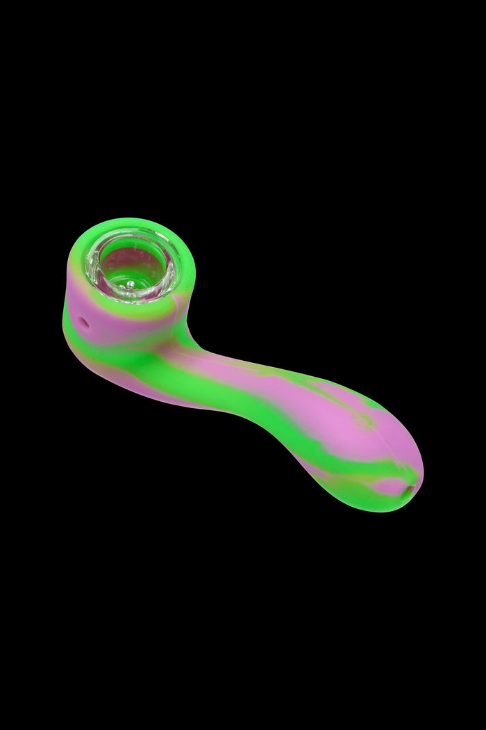 Colorful silicone smoking pipe isolated on a black background.