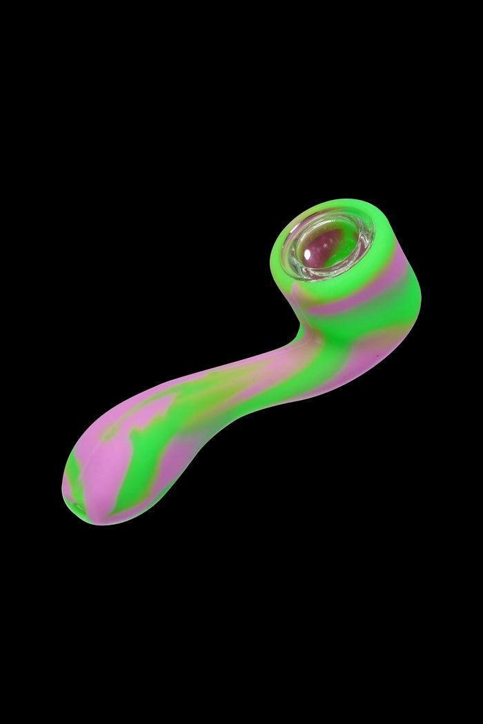 Neon green and pink silicone pipe isolated on a black background.